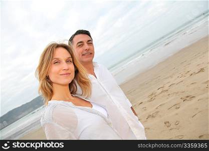 Couple walking by the beach