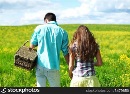 Couple walking in a field