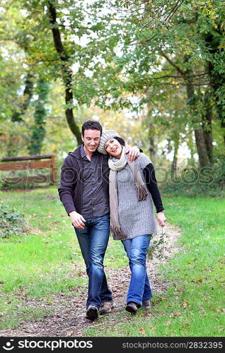 Couple walking in the woods