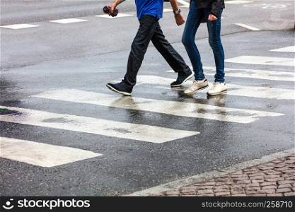 couple walking on a pedestrian crossing