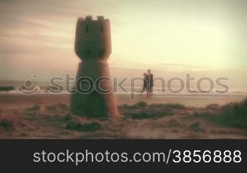 Couple Walking on Beach at Sunrise Holding Hands. Themes: family, vacations, summer, fun, travel, meditation, exercise, values, retirement, nostalgia, lifestyle, romance, happiness, companionship, relationships, summer, travel, destinations...