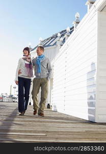 Couple Walking on Beach Boardwalk