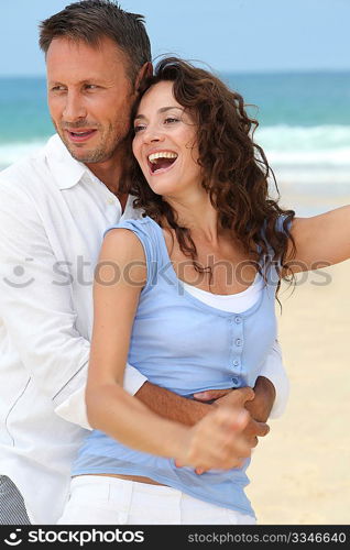 Couple walking on the beach