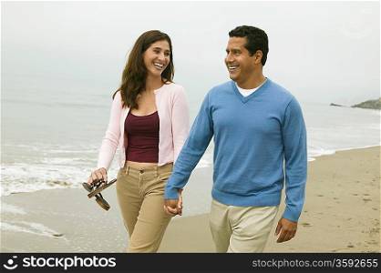 Couple Walking Together on Beach