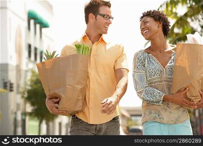 Couple Walking with Groceries in Hand