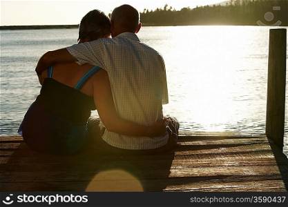 Couple Watching Sunset over Lake