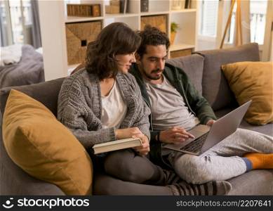 couple watching tv show living room