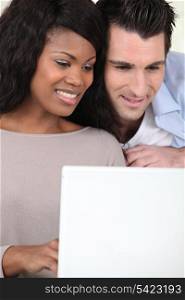 Couple watching video on laptop