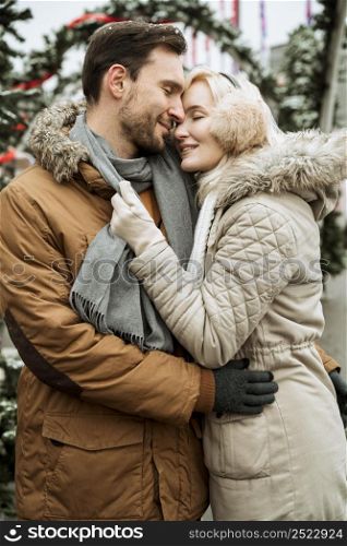 couple winter hugging being happy