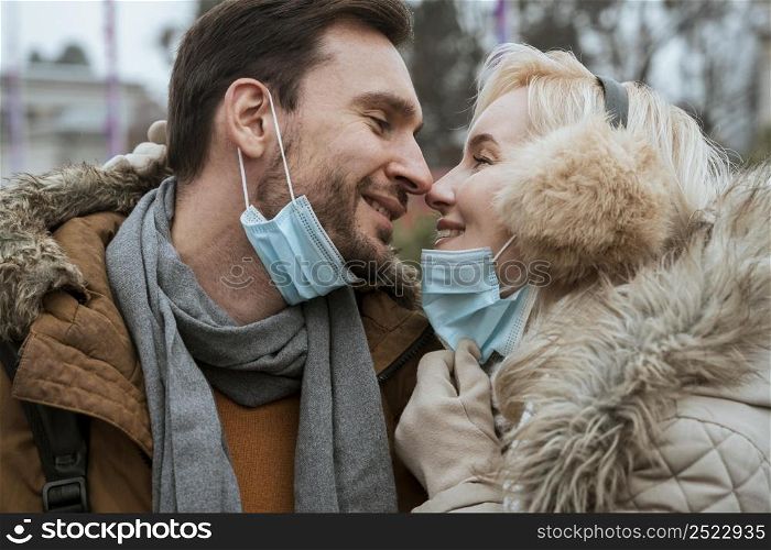 couple winter wearing medical masks