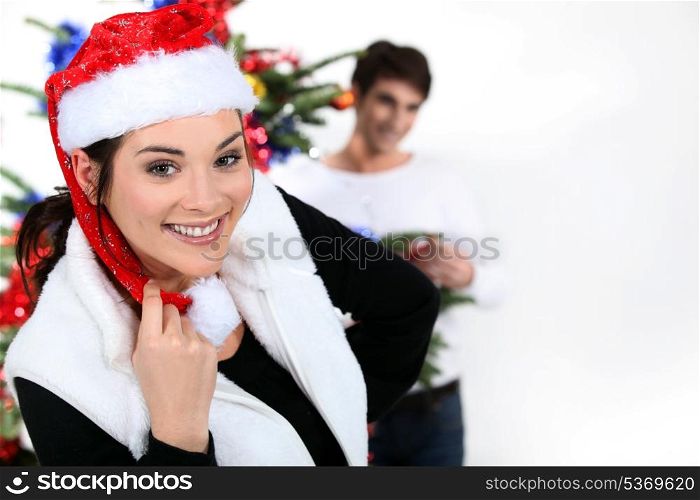 Couple with a Christmas tree