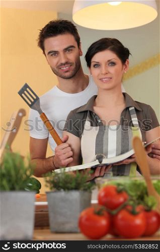 Couple with a cookbook