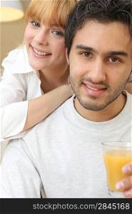 Couple with a glass of orange juice