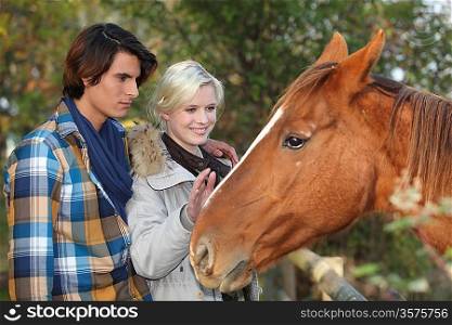 Couple with a horse
