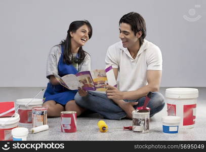 Couple with a paint brochure