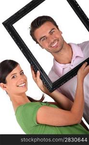 Couple with a picture frame