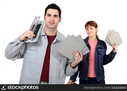 Couple with a tile cutter