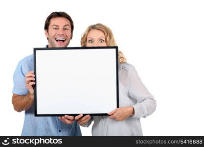 Couple with advertising board