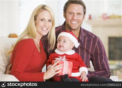 Couple With Baby In Santa Outfit