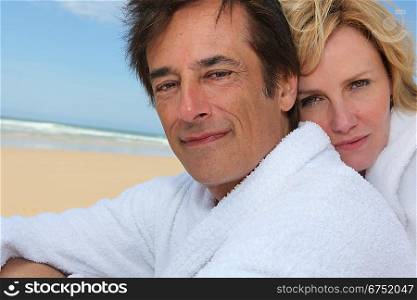 Couple with beach in background