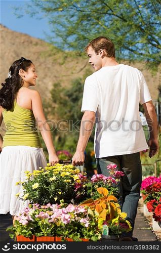 Couple with Cart Full of Flowers