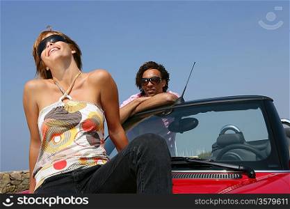 Couple with convertible car