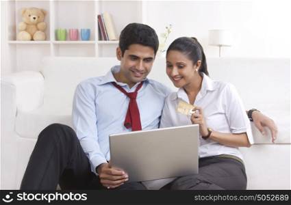 Couple with credit card shopping online