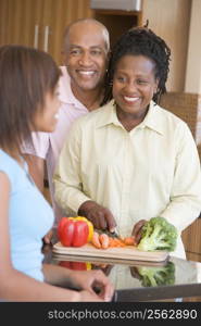 Couple With Daughter Preparing meal,mealtime