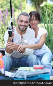 Couple with fishing rod