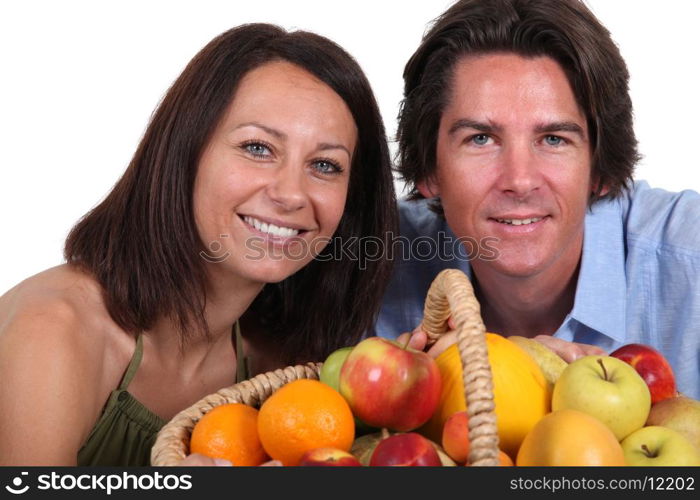 Couple with fruit basket