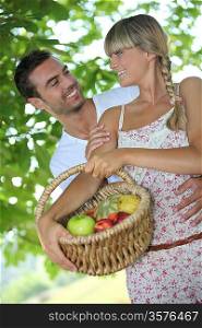 Couple with fruit basket