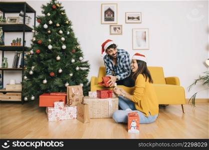 couple with gift boxes home