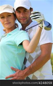 Couple with golf club