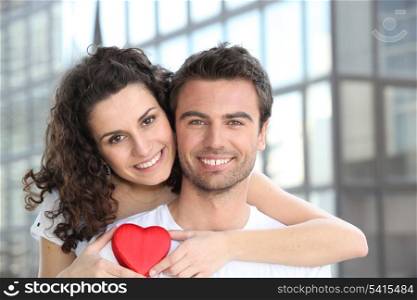 Couple with heart shaped gift