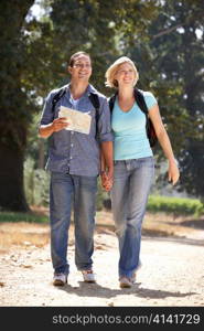 Couple with map on country walk