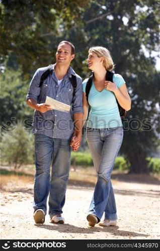 Couple with map on country walk