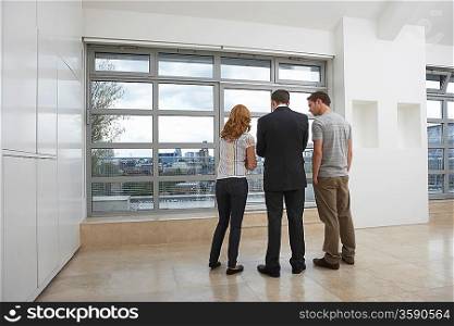 Couple With Real Estate Agent in Apartment