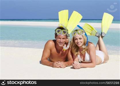 Couple With Snorkels Enjoying Beach Holiday