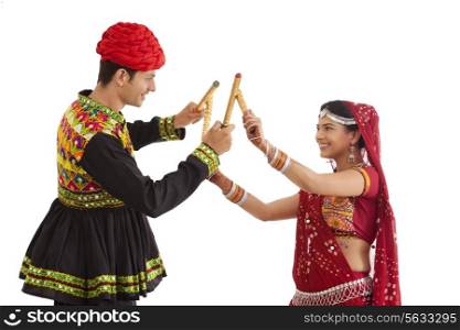 Couple with sticks dancing