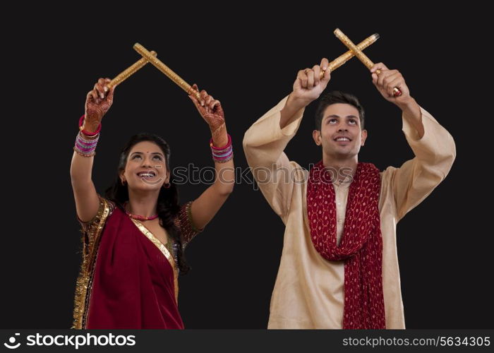 Couple with sticks dancing