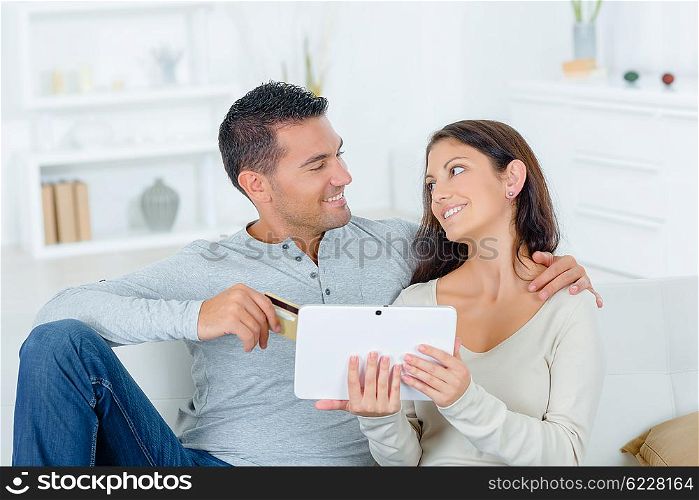 Couple with tablet and credit card