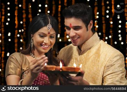 Couple with tray of diyas