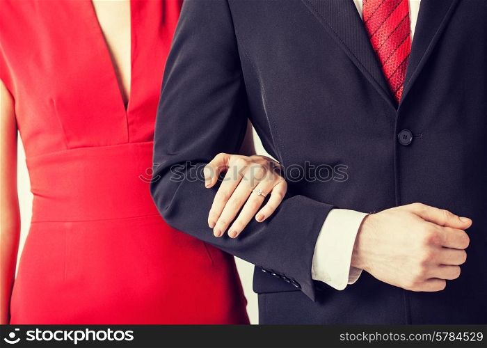 couple with wedding ring holding each other hands
