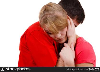 Couple. Woman is sad and being consoled by his partner . Couple hugging. Woman is sad and being consoled by his partner. Man comforting his girlfriend. Troubled girl and her boyfriend. Studio shot on white