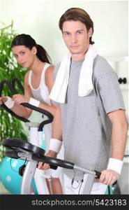 Couple working-out at the gym