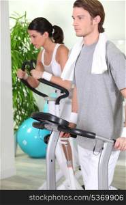 Couple working out in a gym