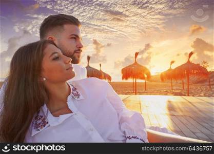 Couple young happy in beach vacation sunrise at Spain