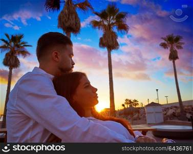 Couple young hug in beach vacation sunrise in Spain