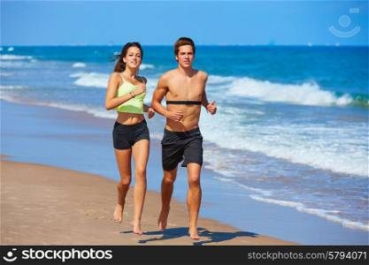 Couple young running in the beach in summer vacation