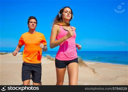 Couple young running in the beach in summer vacations
